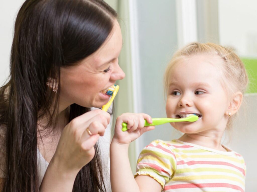 Parent and child brushing their teeth | Choice Moving Company