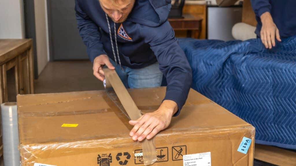 a man packing a box