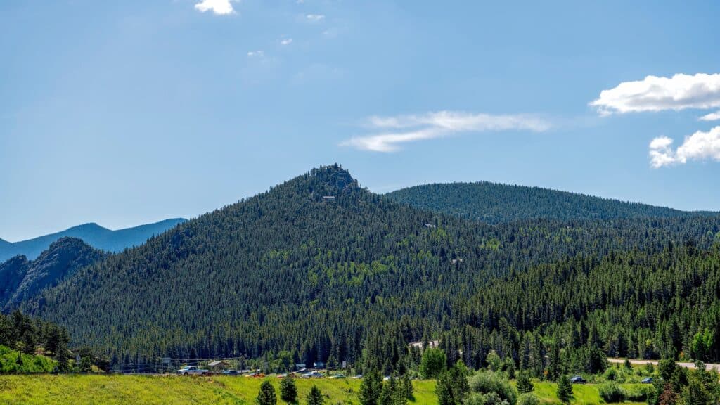 Green mountains with blue sky and clouds